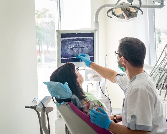 showing woman x-ray at dental exam in Leesburg   