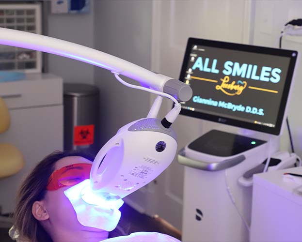 Patient receiving zoom teeth whitening treatment