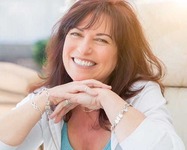 Woman showing offer her smile after a makeover