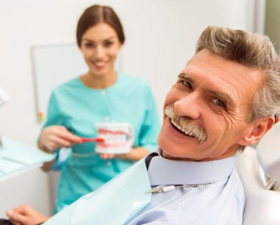 a patient receiving dentures in Leesburg