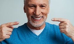 a man smiling after replacing missing teeth in Leesburg