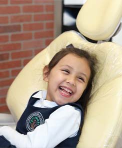 Little girl in dental chair smiling in Leesburg