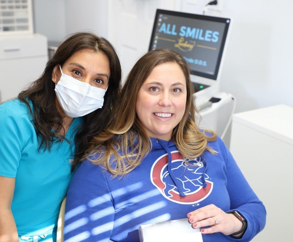 Dentist and patient smiling together in Leesburg