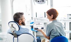 Dentist in Leesburg talking to patient about Invisalign