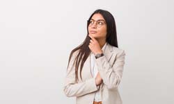 Closeup of woman wondering about the cost of Invisalign in Leesburg