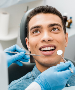 Man in denim shirt about to have dental exam