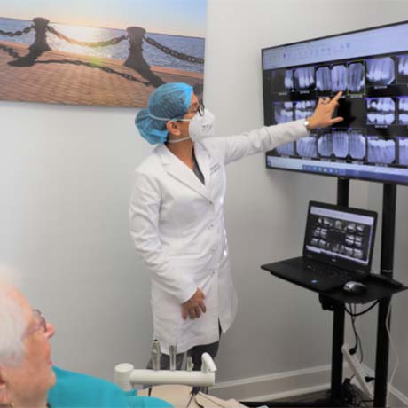 dentist showing patient an x-ray