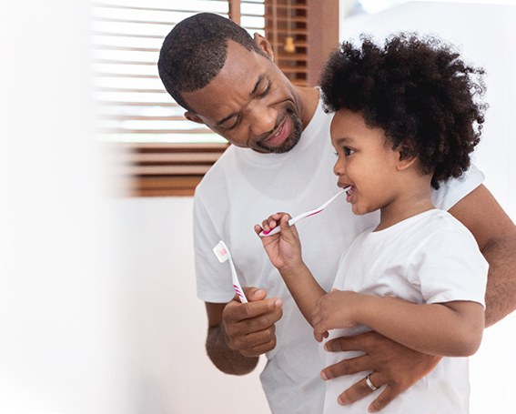 Father helping son prevent dental emergencies in Leesburg