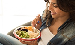 Woman eating a healthy bowl