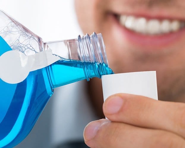 Patient using mouthwash