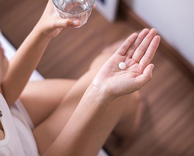 Dental patient taking oral conscious sedation dentistry pill