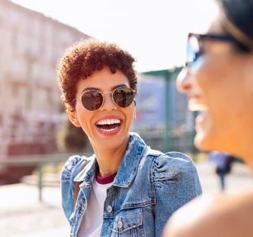 Woman with gorgeous smile after cosmetic dentistry