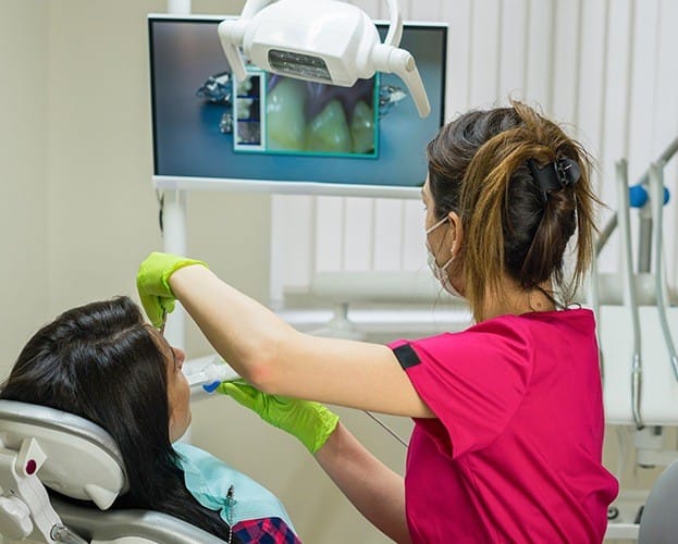 Dentist capturing smile photos with intraoral camera