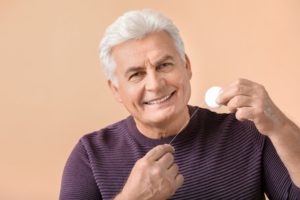 mature man flossing 