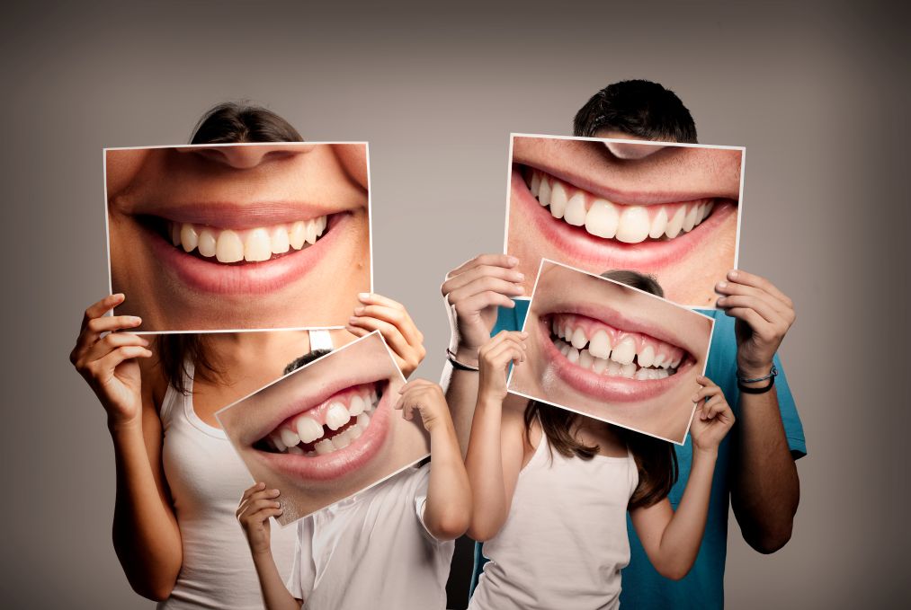 A closeup of family members’ teeth.